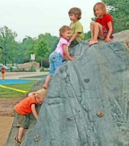 Rock climbing at All Children's Playground, an inclusive playground