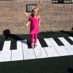 Make music with a large floor piano at inclusive playground