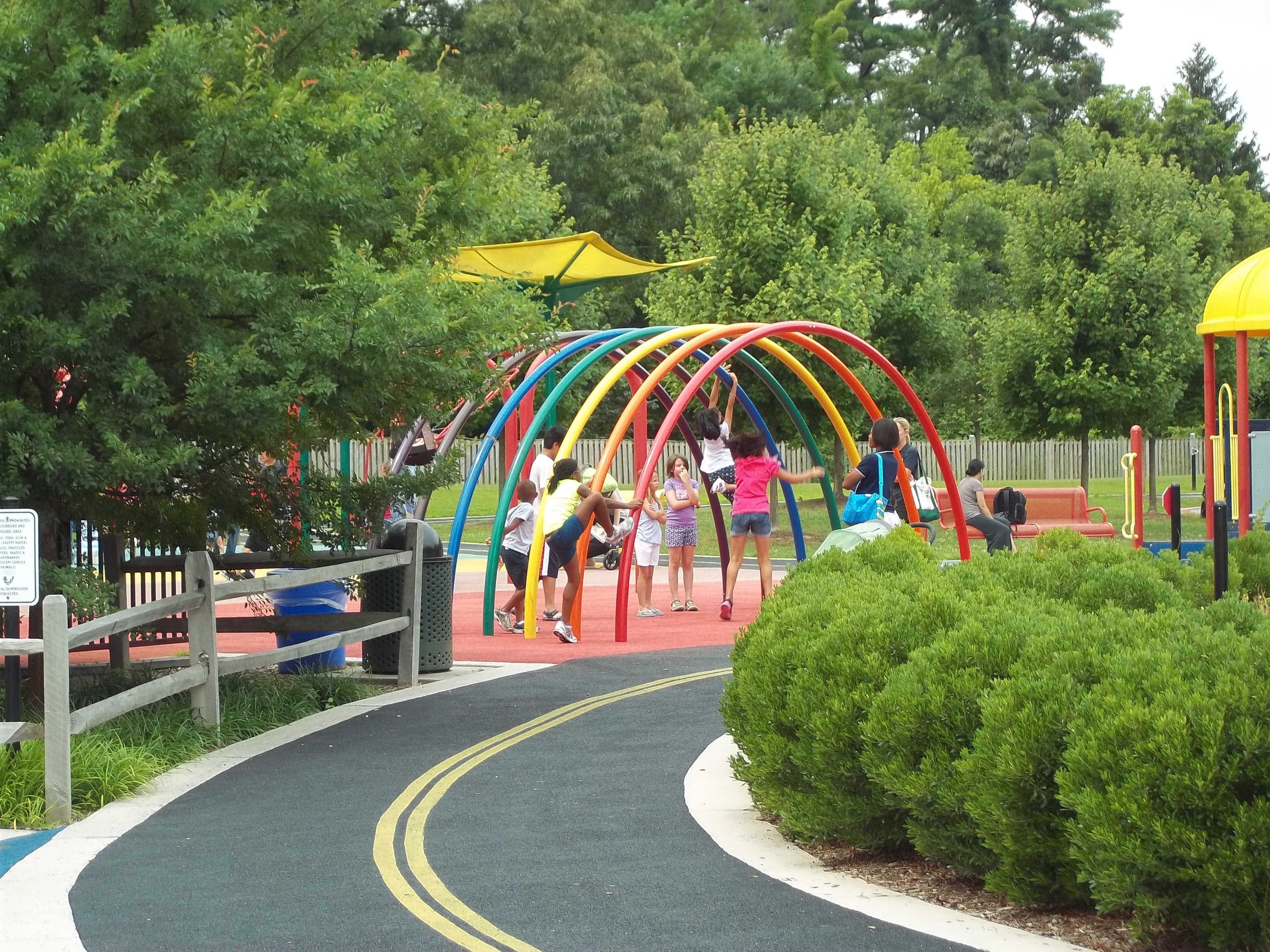 perimeter path and rainbow climber | Accessible Playgrounds